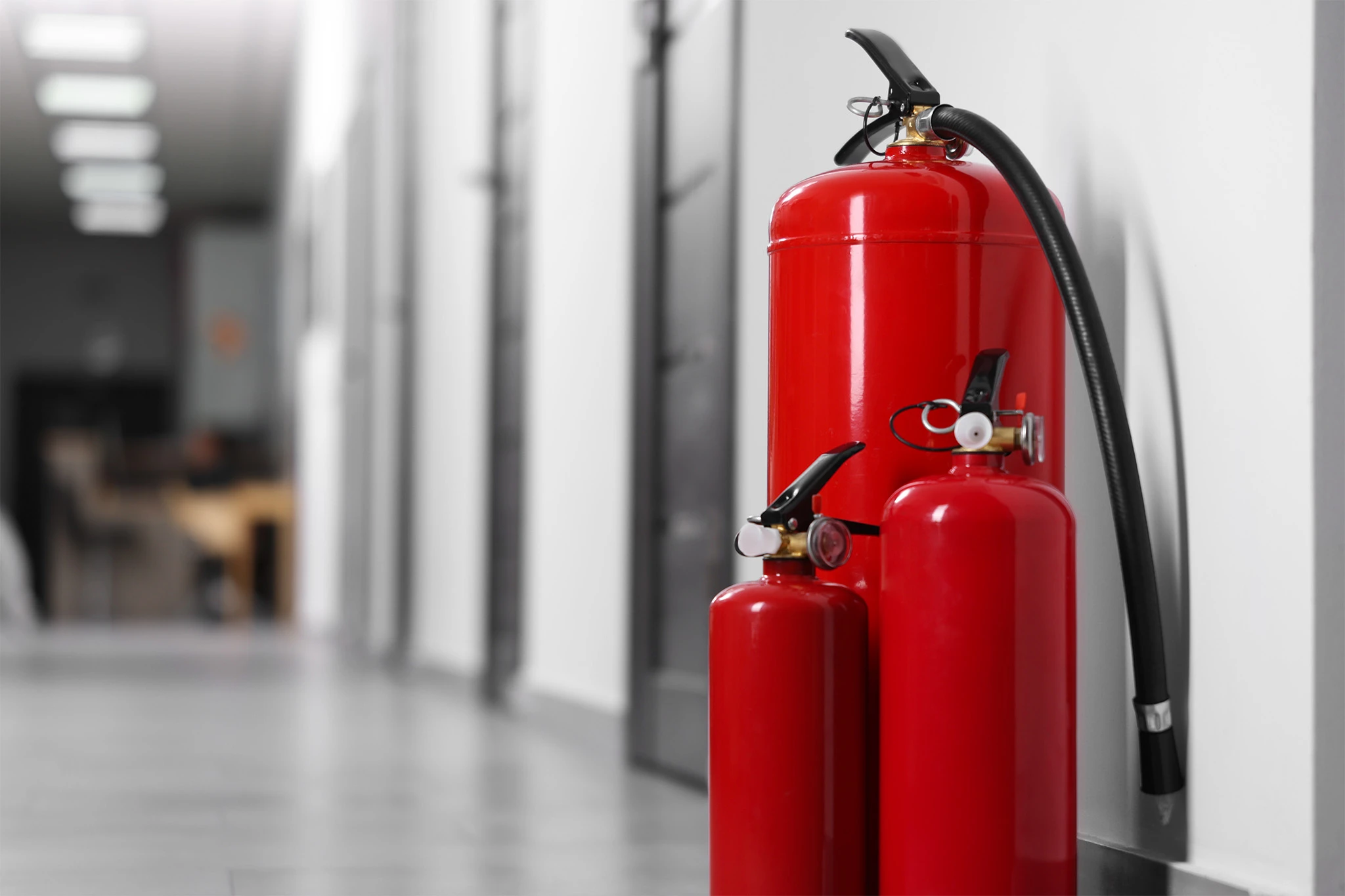 Fire extinguishers in hall closeup space for tex 2026 05 20 16 01 10 utc