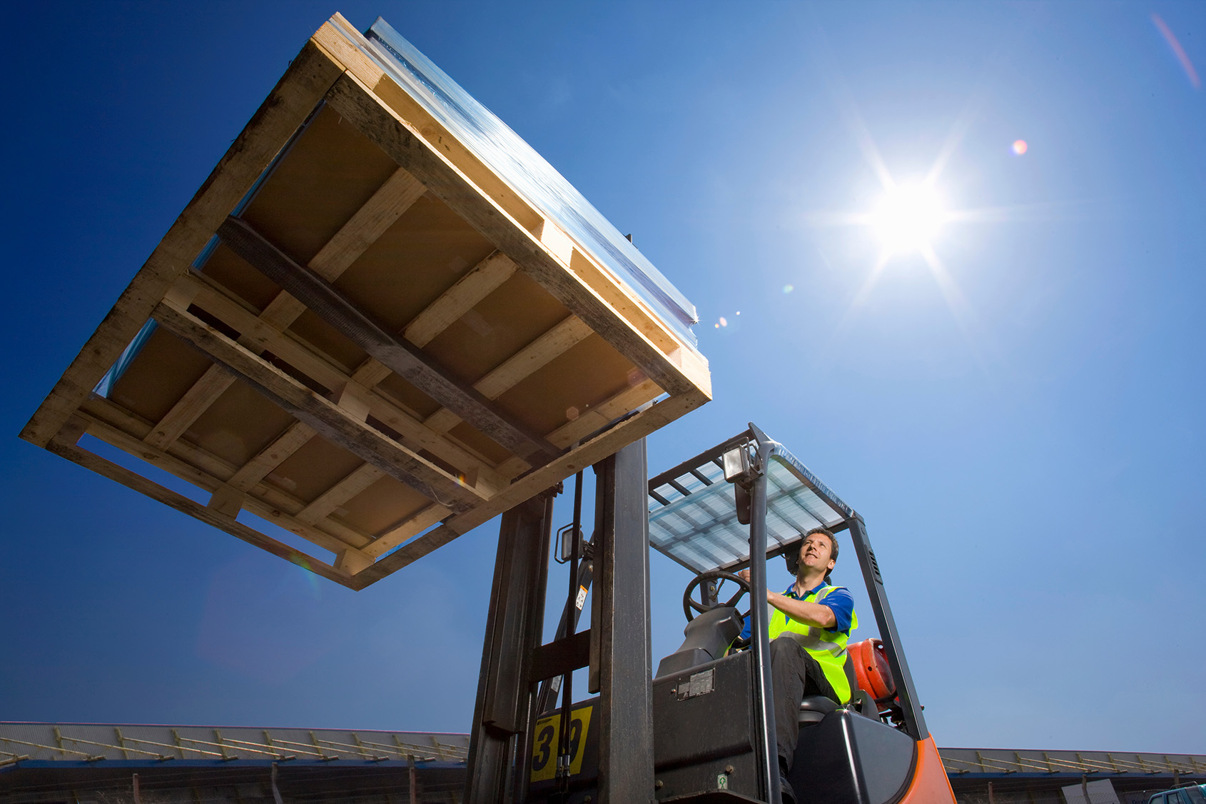 Forklift driver lifting pallet in sunny conditions 2026 01 11 08 39 04 utc