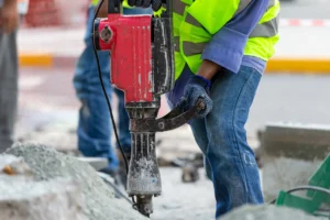 Man drilling the asphalt in the street closeup on 2026 03 19 22 50 08 utc