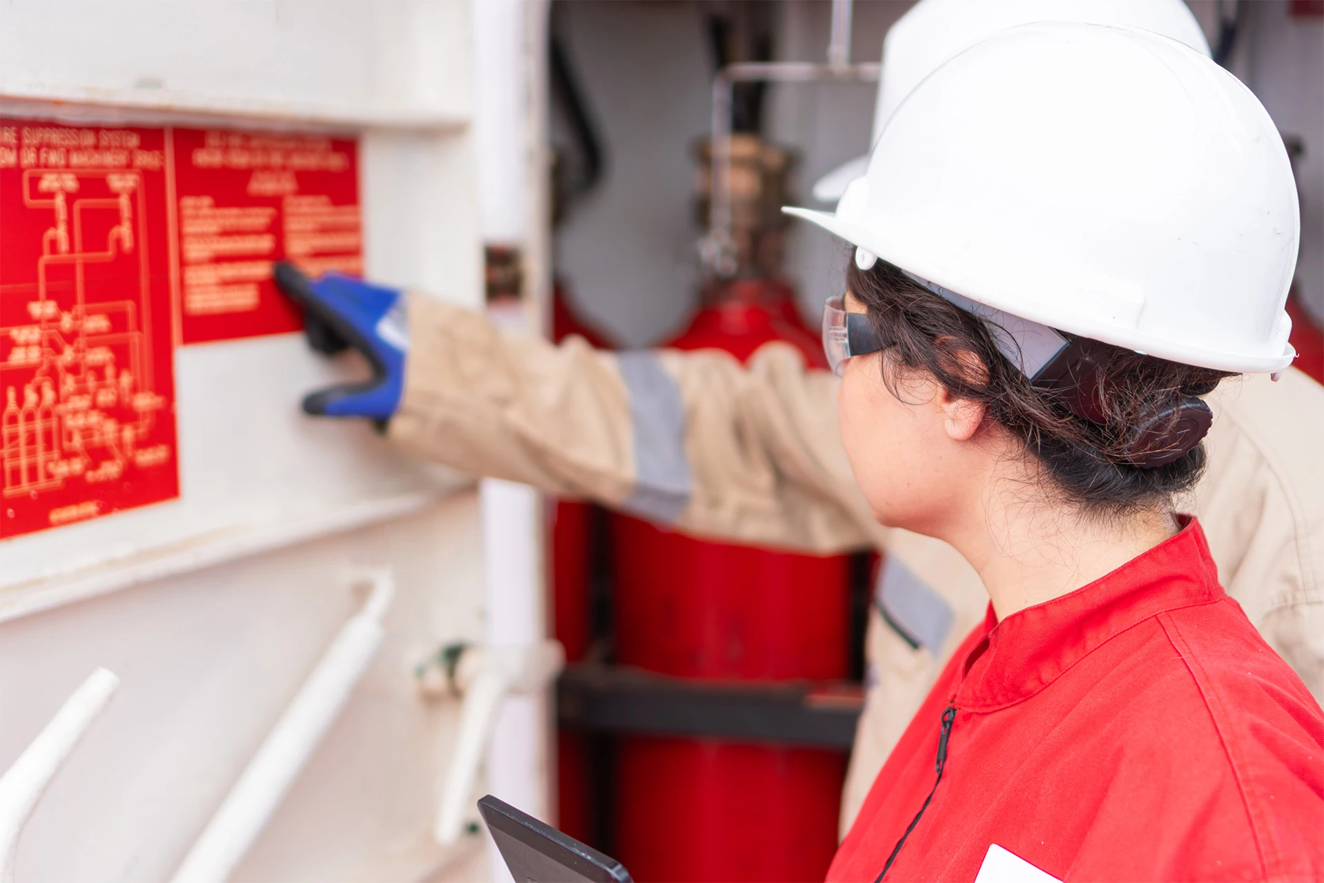 Technician inspecting fire suppression system at w 2026 03 25 08 55 43 utc