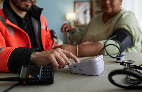 Male paramedic measuring blood pressure of middle 2026 01 11 10 30 29 utc