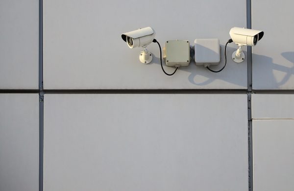 White surveillance camera built into the metal wal 2026 03 20 03 41 45 utc